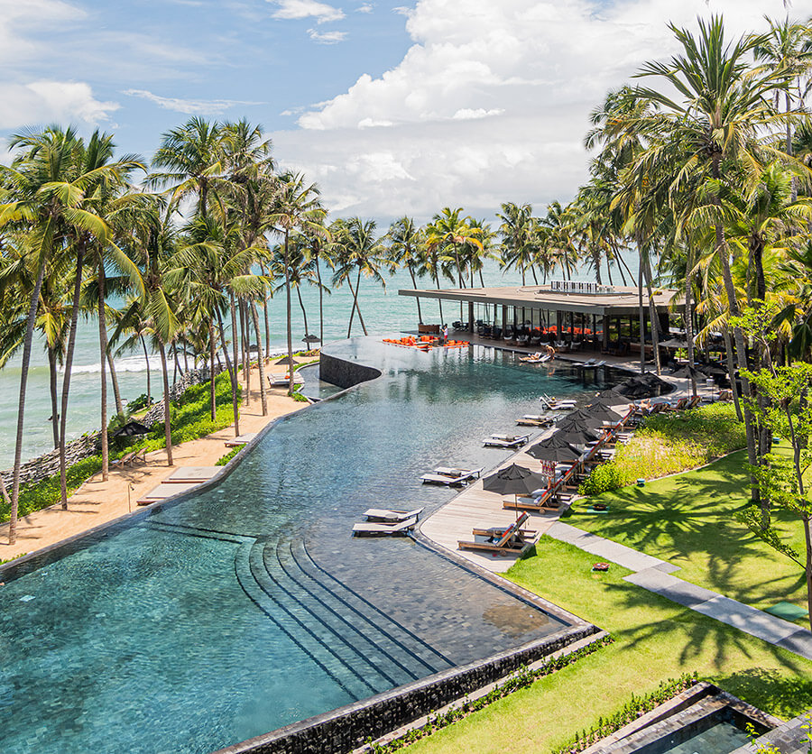 Carmel Taíba Exclusive Resort — beachfront pool and palms